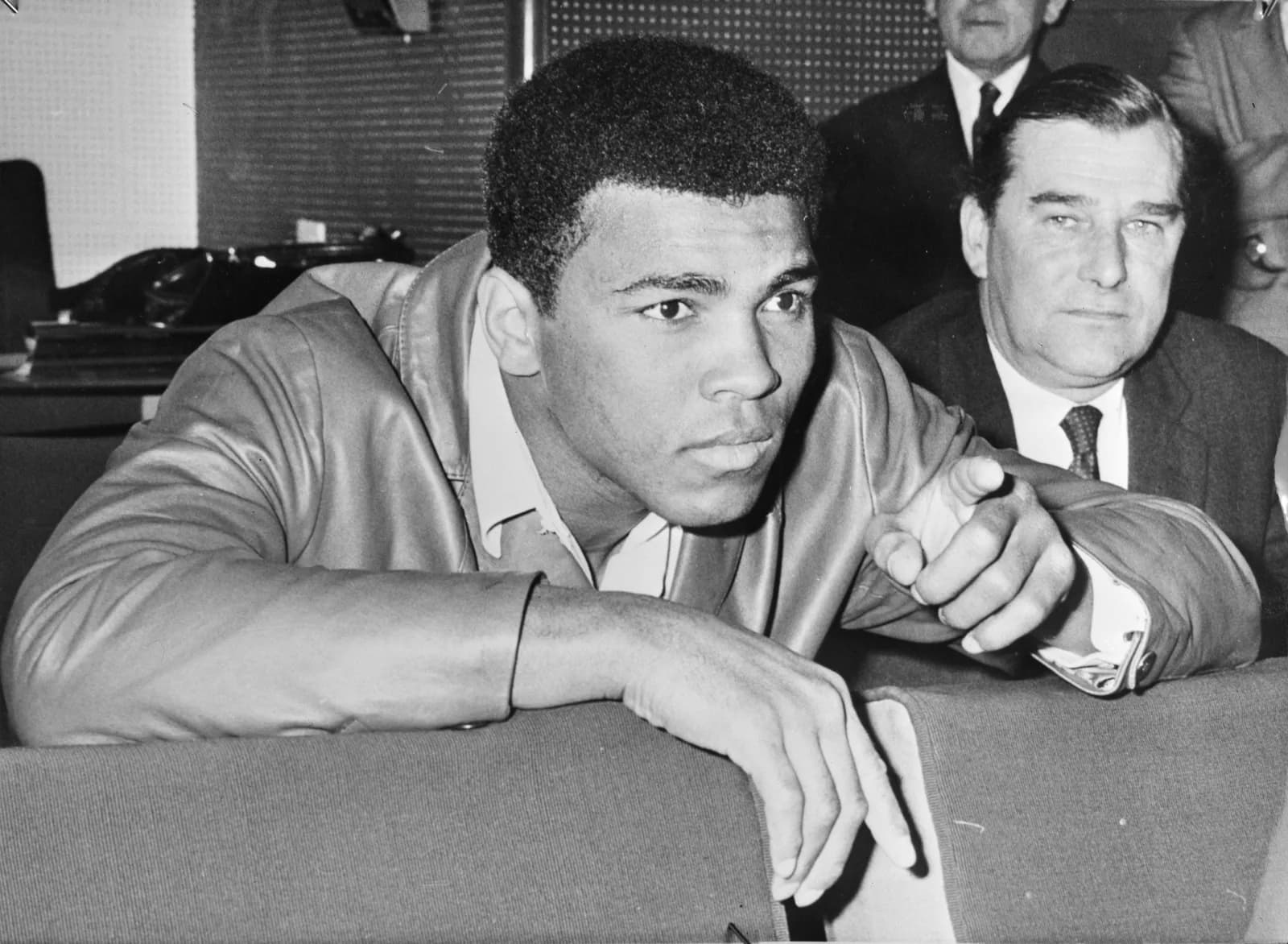 Muhammad Ali, in a dark coat and open shirt, photographed talking during a visit to the Netherlands in February 1971.