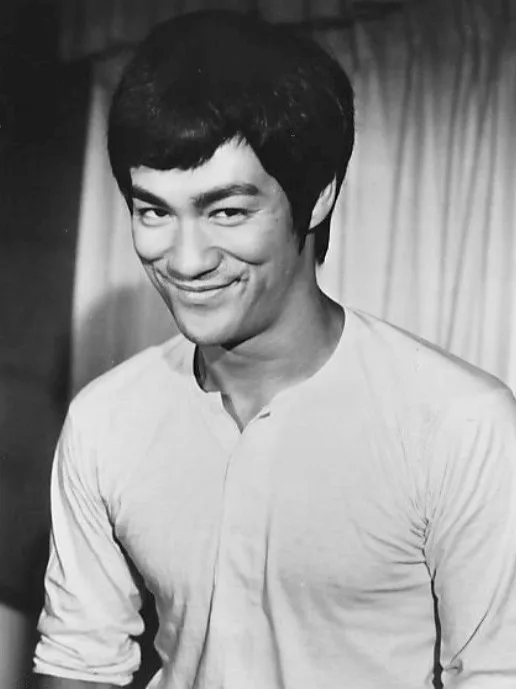 Bruce Lee, bare-chested and in a fighting stance, in a publicity photograph for The Big Boss.