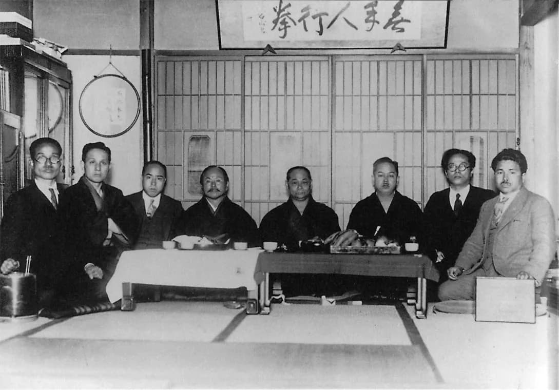 Group photograph of Okinawan and Japanese karate masters in formal dress, taken in Naha in 1936.