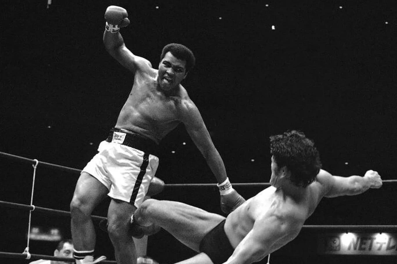 Antonio Inoki lies on his back and kicks at the legs of a standing Muhammad Ali during their 1976 bout in Tokyo.