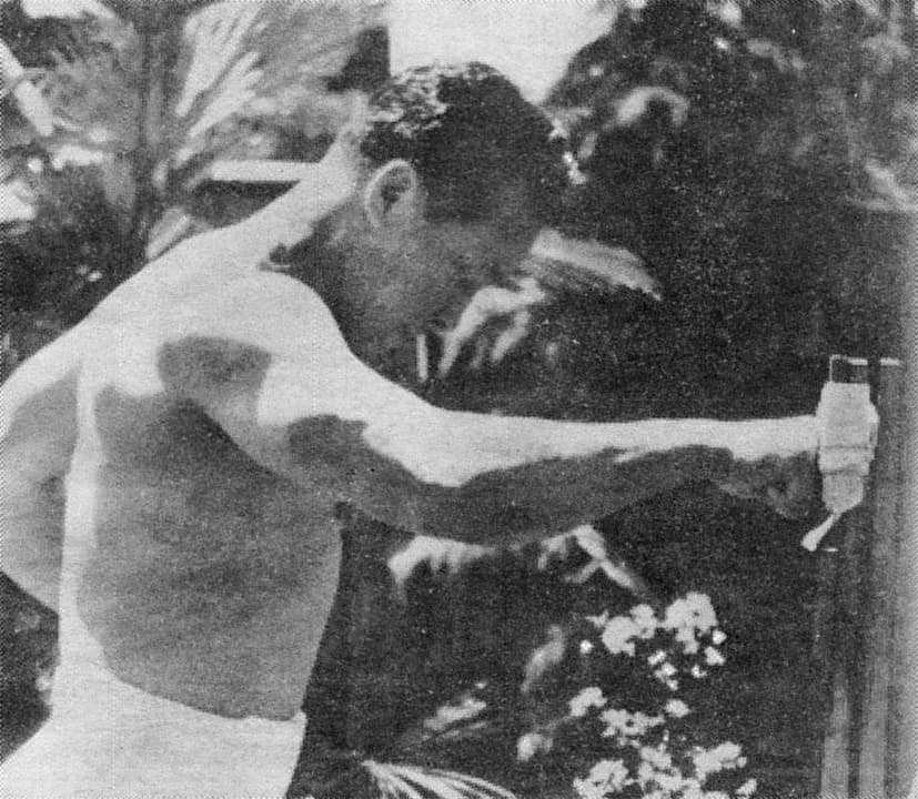 Mas Oyama in a white karate gi demonstrating a technique in 1954.