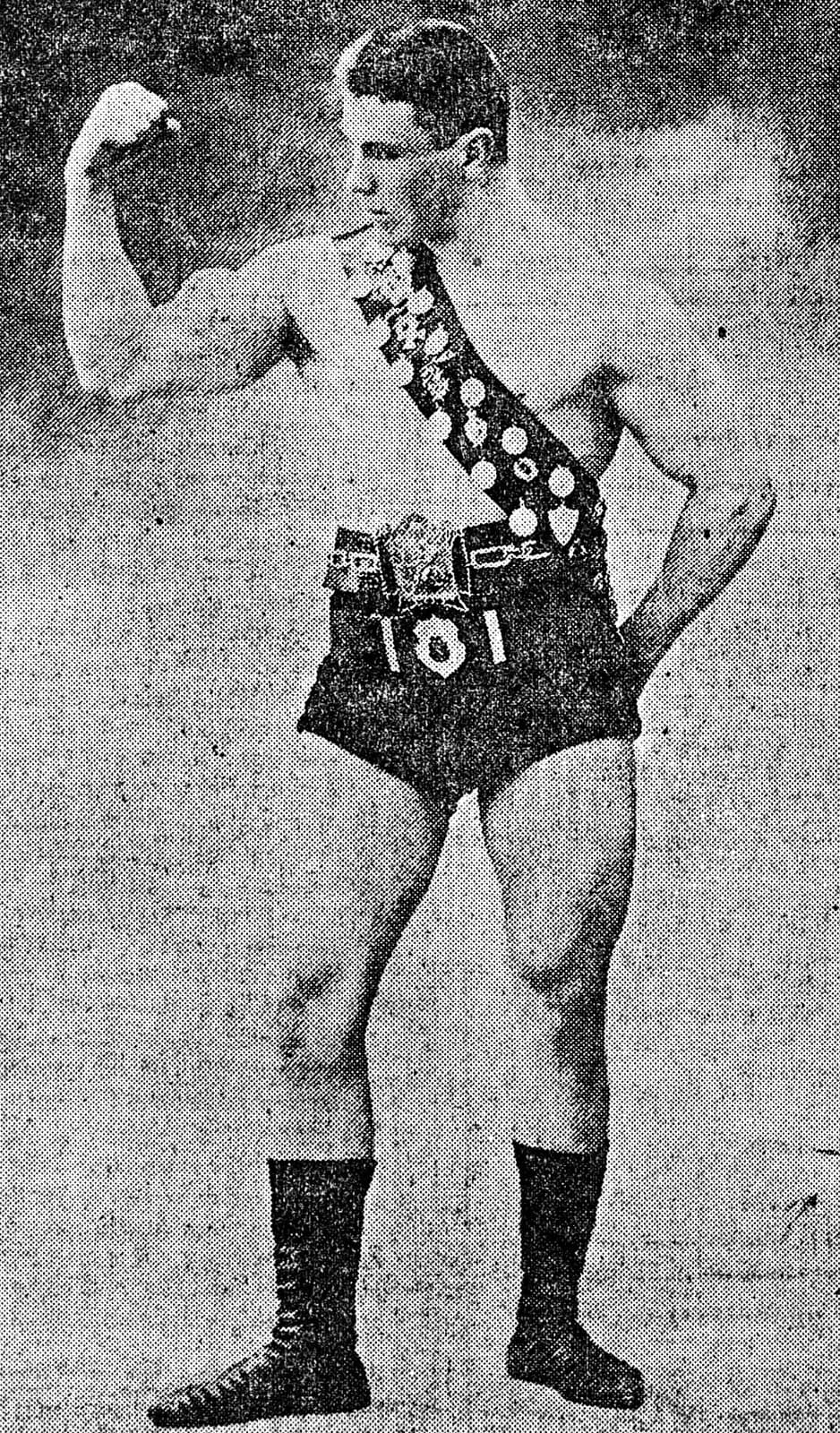 Studio photograph of George Hackenschmidt in 1906, a heavily muscled wrestler posing bare-chested.
